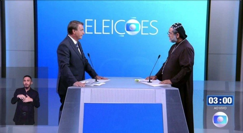 Bolsonaro e Padre Kelmon no debate da Globo