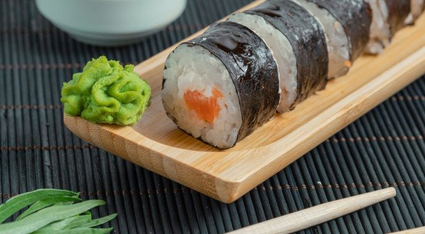 Top view of sushi rolls on black background. High quality photo