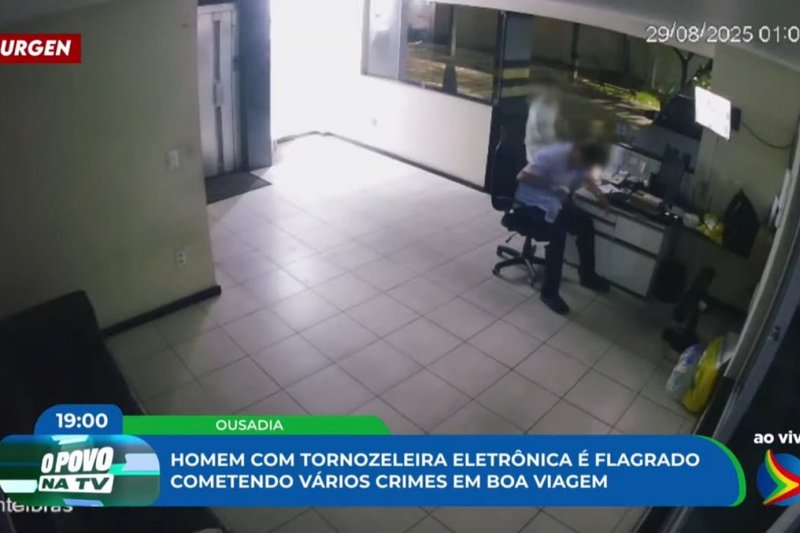 Imagem de câmera de segurança flagra momento em que suspeito rouba celular de porteiro de prédio, em Boa Viagem