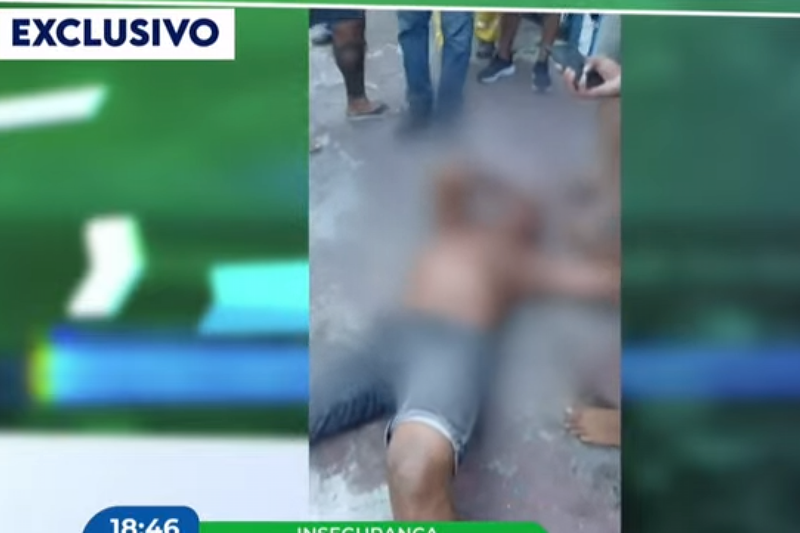 Imagem de suspeito de roubos em farmácias no chão durante tentativa de linchamento em Casa Amarela